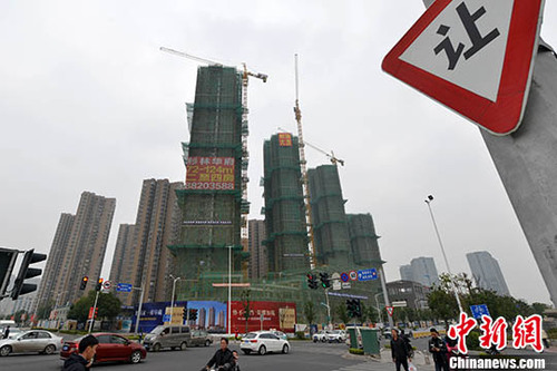 資料圖：福州一處商品房在建中。 <a target='_blank' href='http://www.chinanews.com/'>中新社</a>記者 呂明 攝